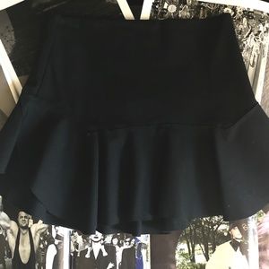 "LIONESS" FLARE MINI SKIRT IN BLK